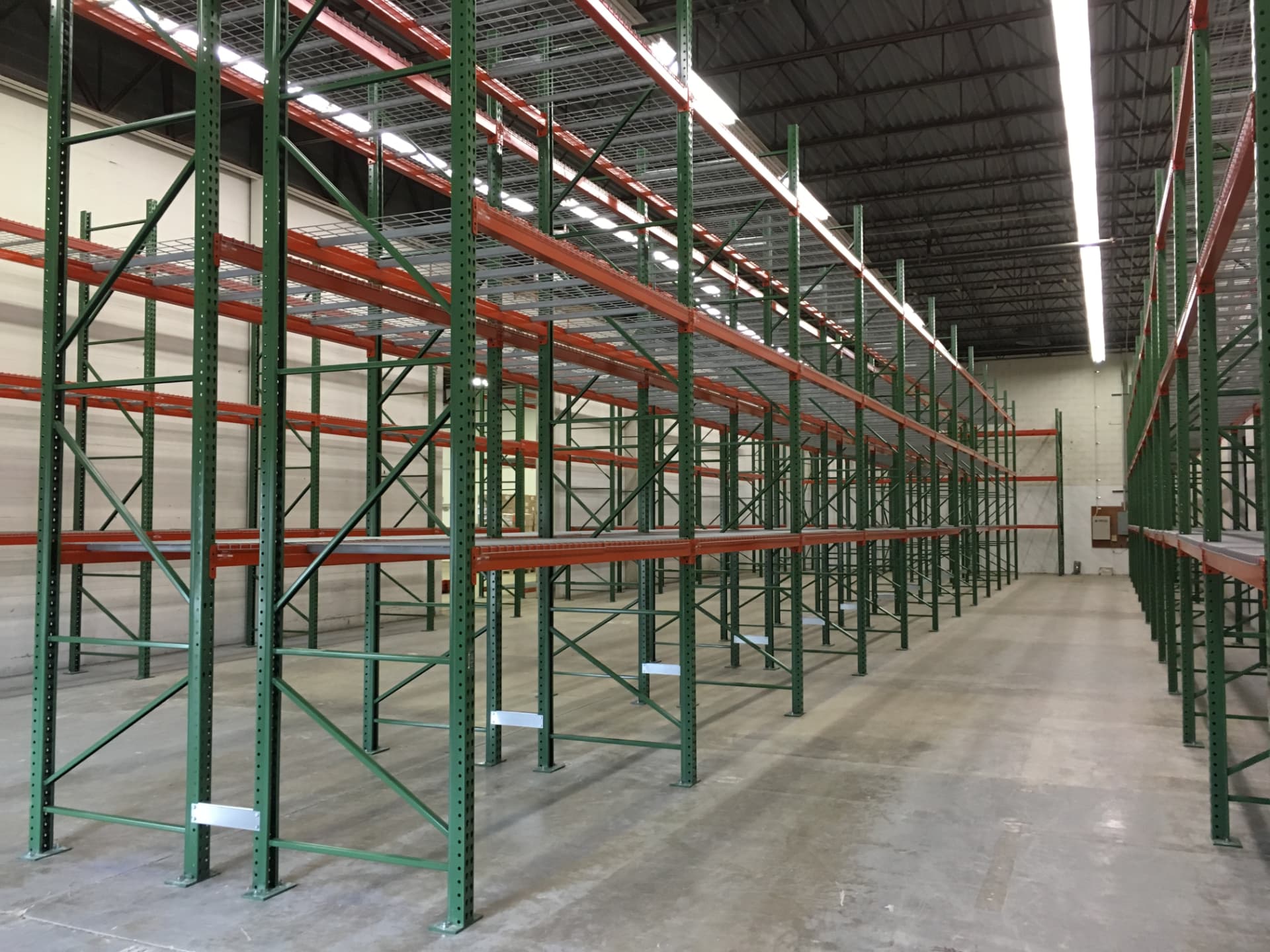 Newly installed pallet rack uprights and beams