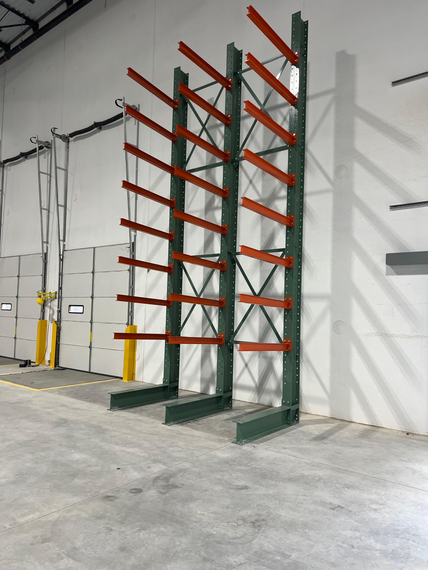 Cantilever rack installed along a warehouse wall